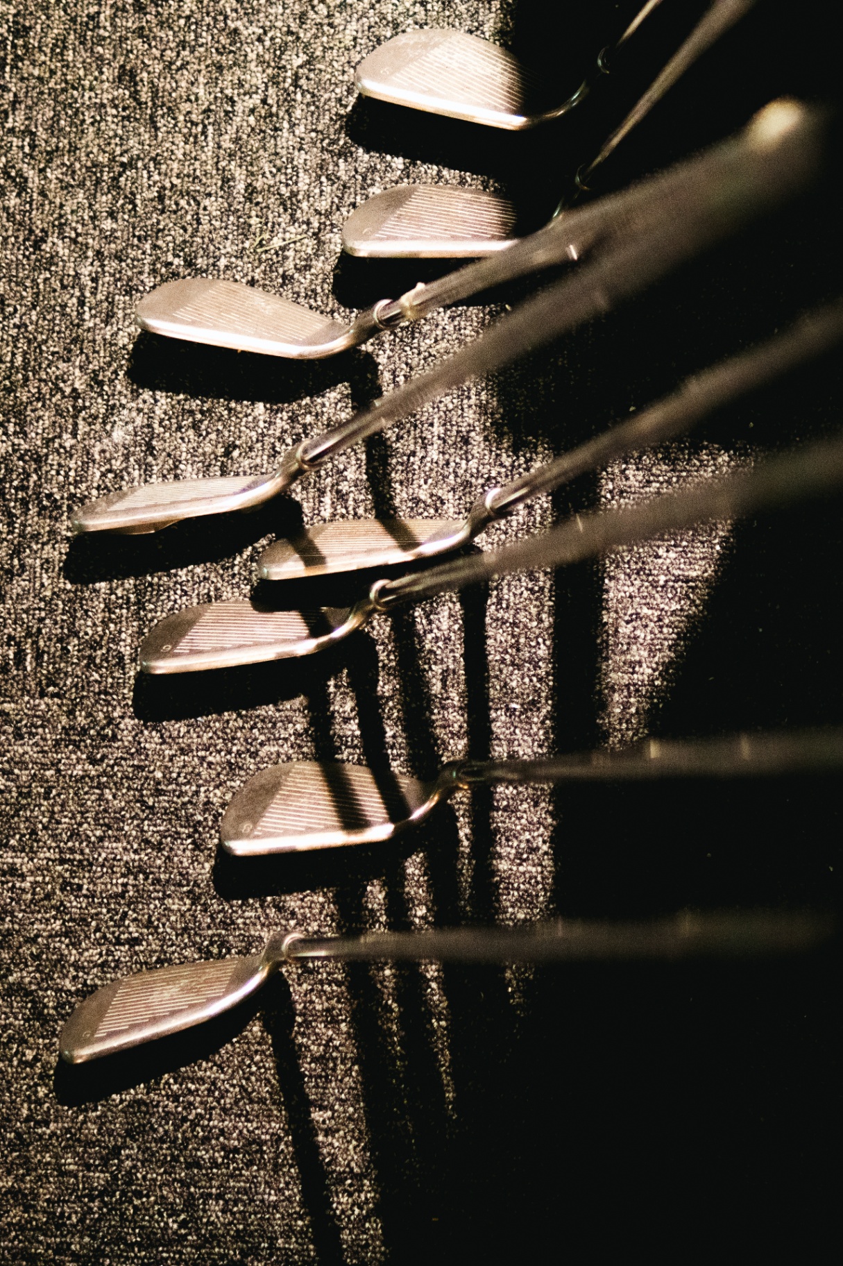 Golfklubbor i ställ